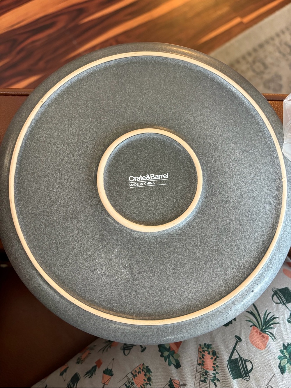 Crate&Barrel Matte Gray Stoneware Charger with Natural Rim and White candle